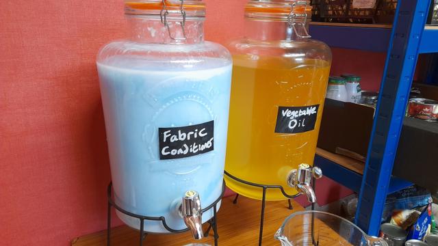 fabric softener and vegetable oil in refill jars 