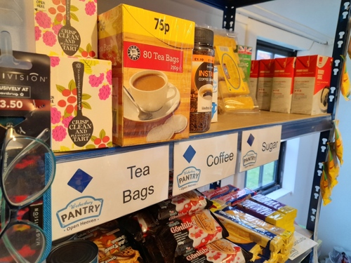 Shelving with packet food and food in cans