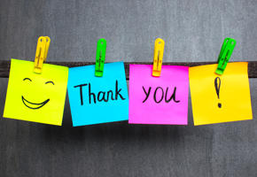 Thank You shown on post it notes on a clothes lines with a smiley face and exclamation mark