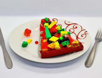 a plate with pizza made of lego