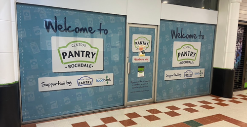Exterior of Rochdale Central Pantry with the Your Local Pantry and Foodbank logos