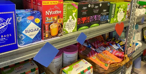 Shelving with packet food and food in cans