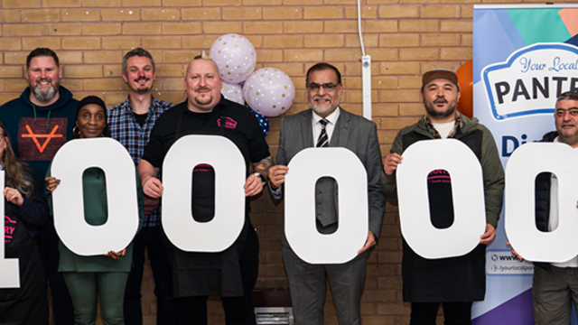 collection of people holding up letter signs to make the number one Million 