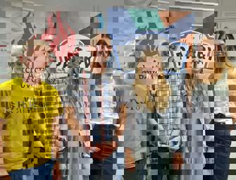 two woman and two men in front of pantry and church action poverty signs