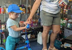 woman and child on a blue bike