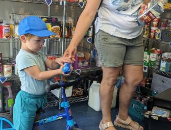 woman and child on a blue bike