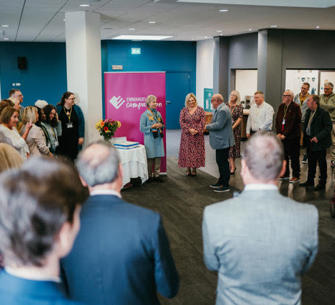 behind view of people at a conference